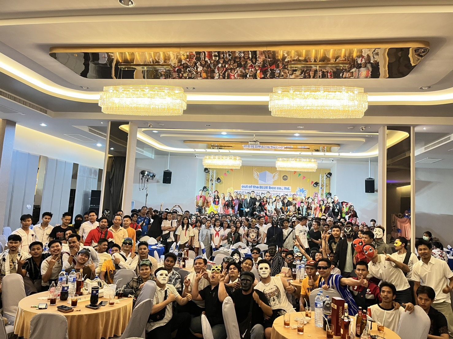 Guests at round banquet tables during a company celebration