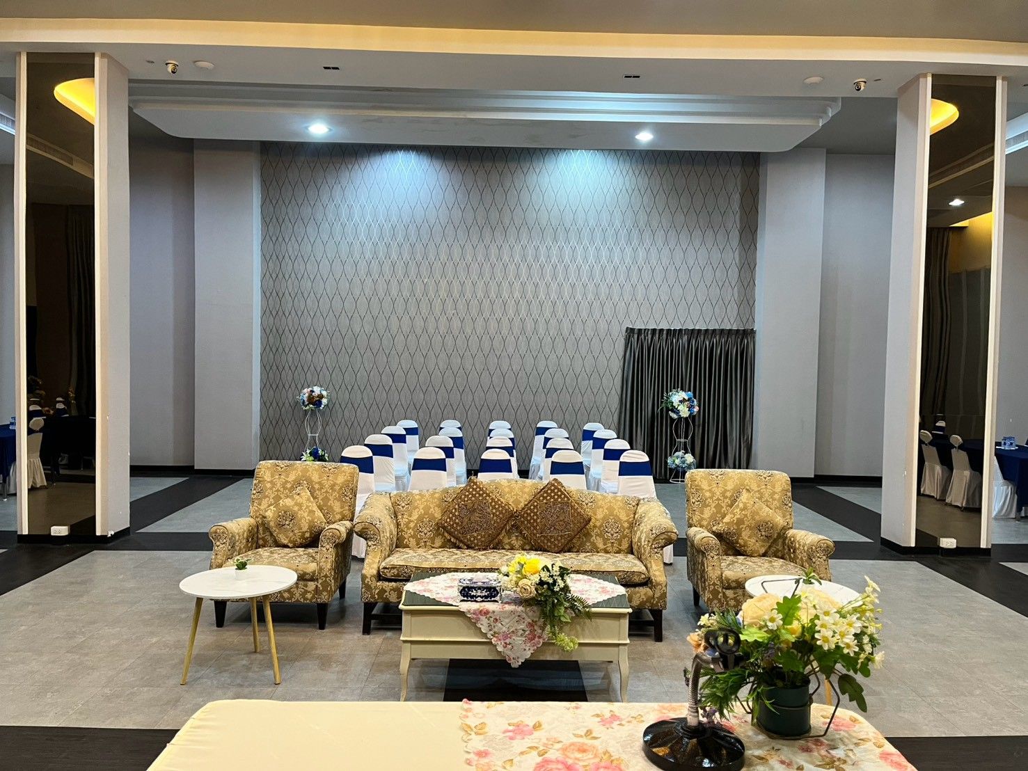 VIP sofa set at the front of the room for guests of honour