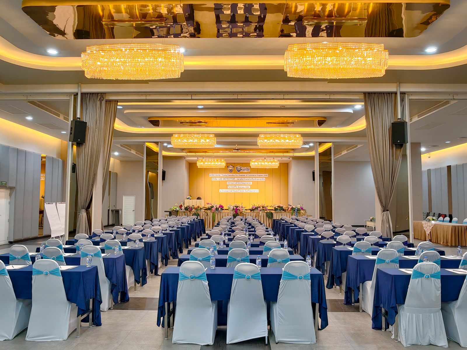 Grand Norasing ballroom set classroom-style under crystal chandeliers