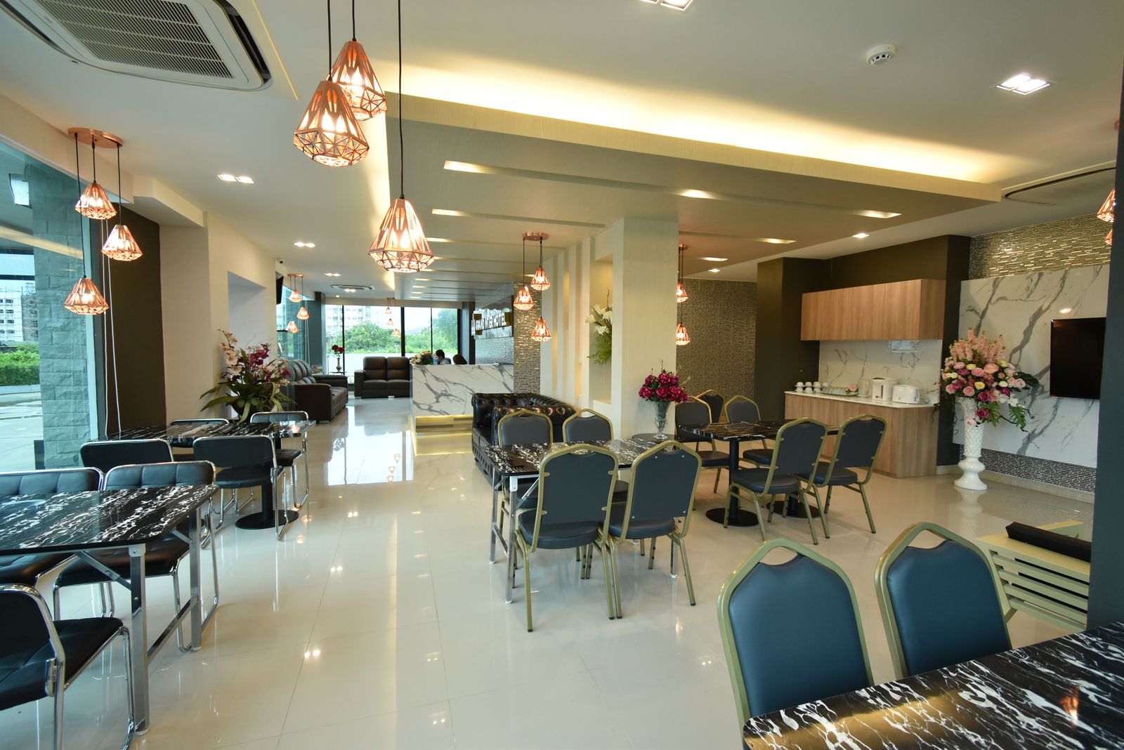 Lobby lounge and dining area with copper pendant lights