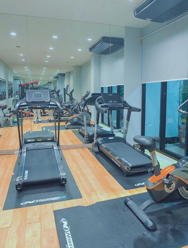Fitness room with treadmills facing the windows