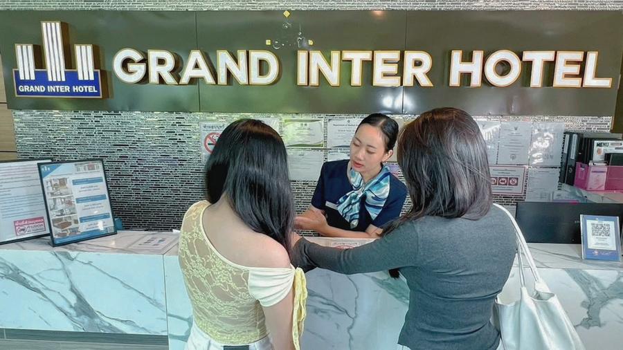 Guests checking in at the reception desk