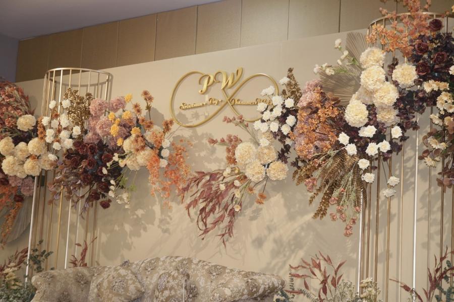 Floral backdrop with the couple's monogram