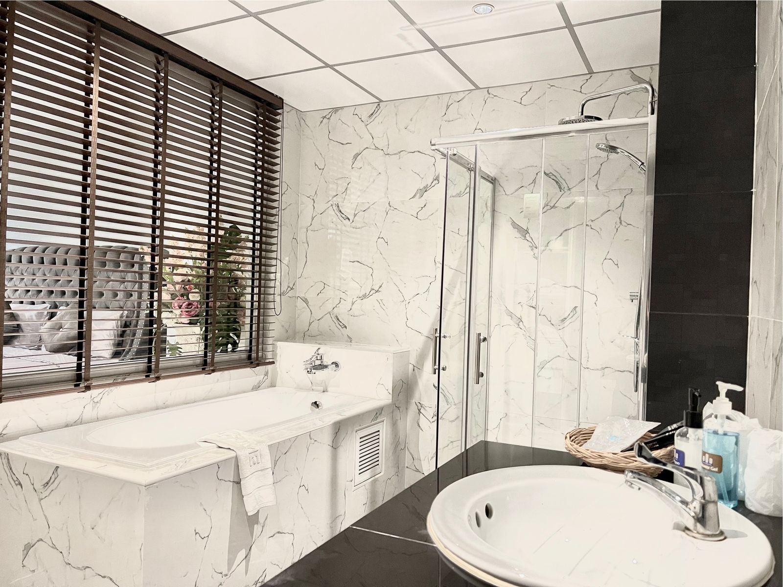 Bathtub and vanity beside the window
