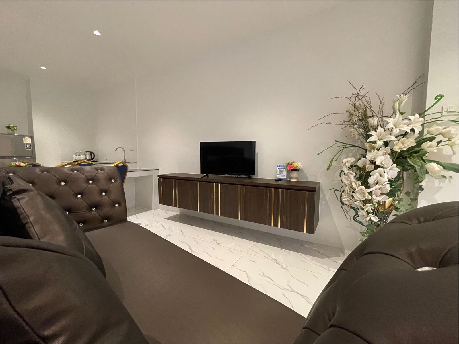 Lounge seating facing the TV console